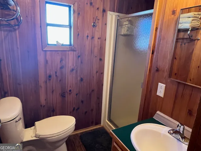 a white toilet sitting next to a bathroom sink