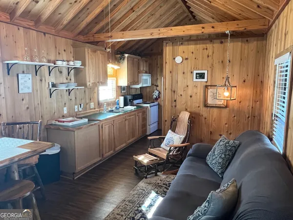 a living room with lots of furniture and a chandelier