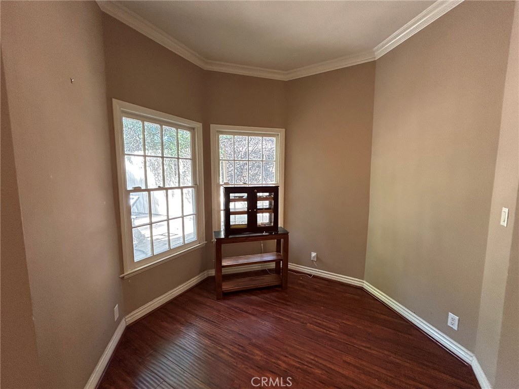 300 South Timken Road Anaheim, CA 92808 - Photo 11 of 40 an empty room with wooden floor closet and windows