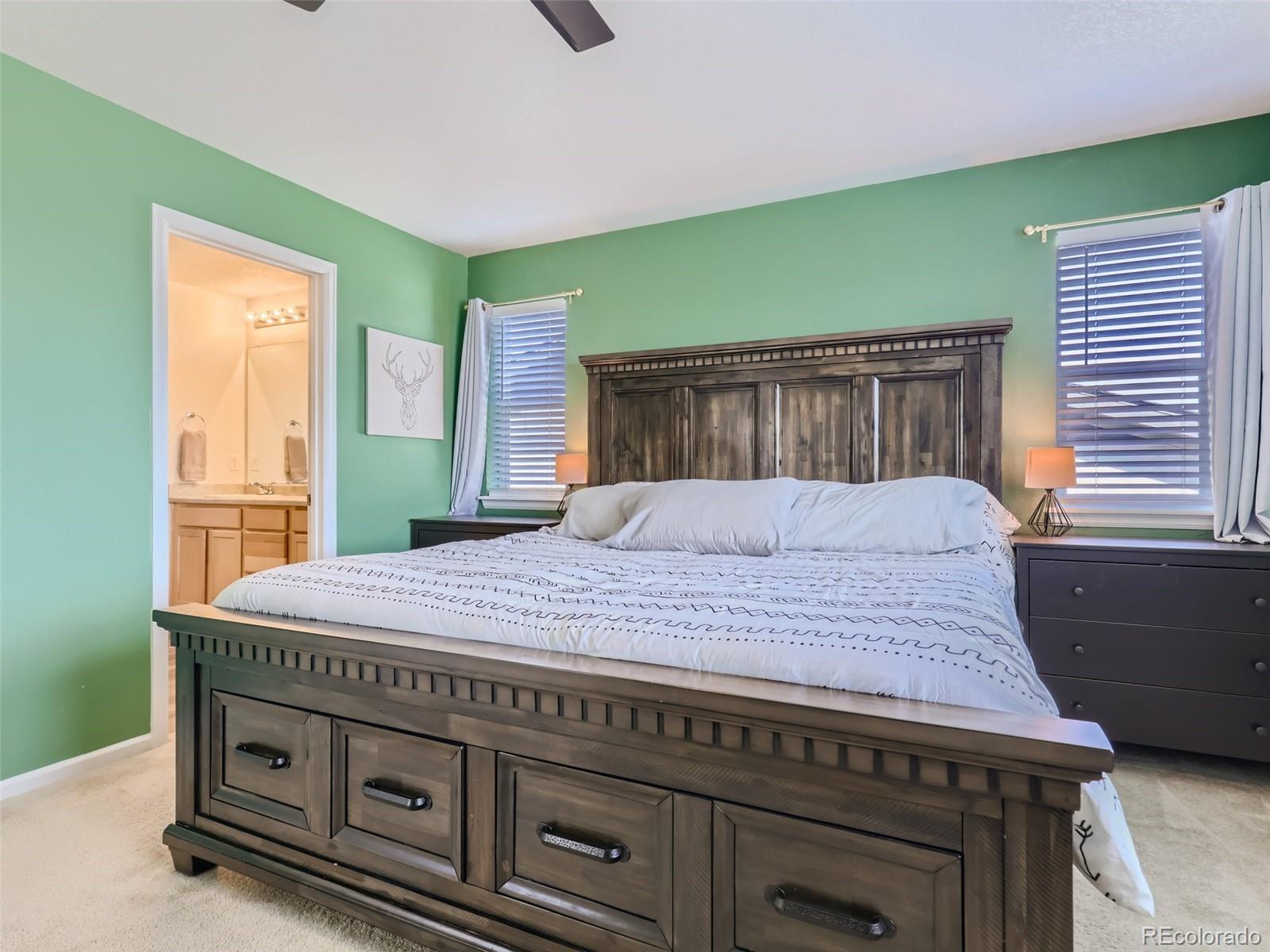 6430 Dry Fork Circle Frederick, CO 80516 - Photo 14 of 32 a bedroom with a bed and a window