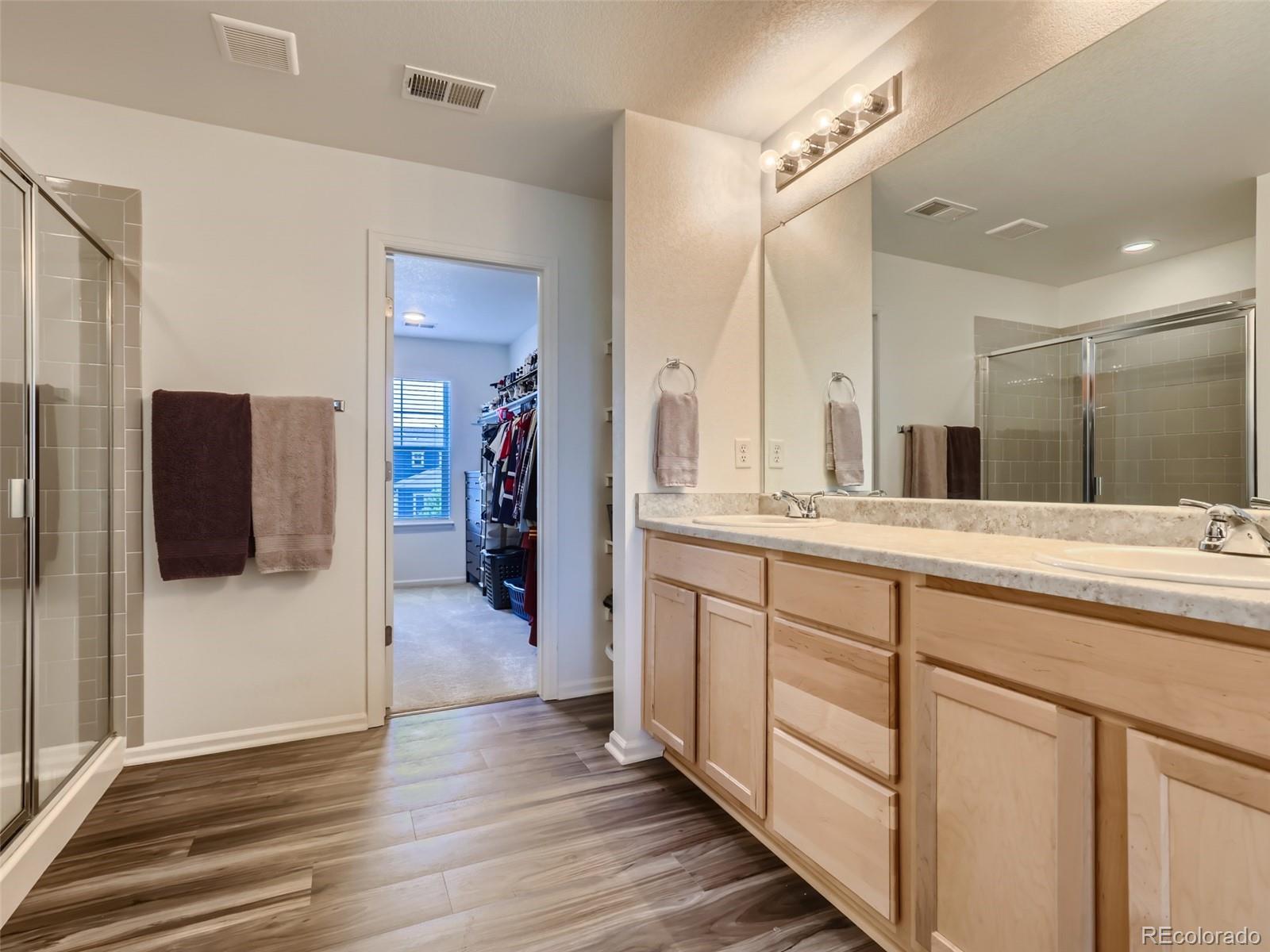 6430 Dry Fork Circle Frederick, CO 80516 - Photo 15 of 32 a bathroom with a sink and a mirror