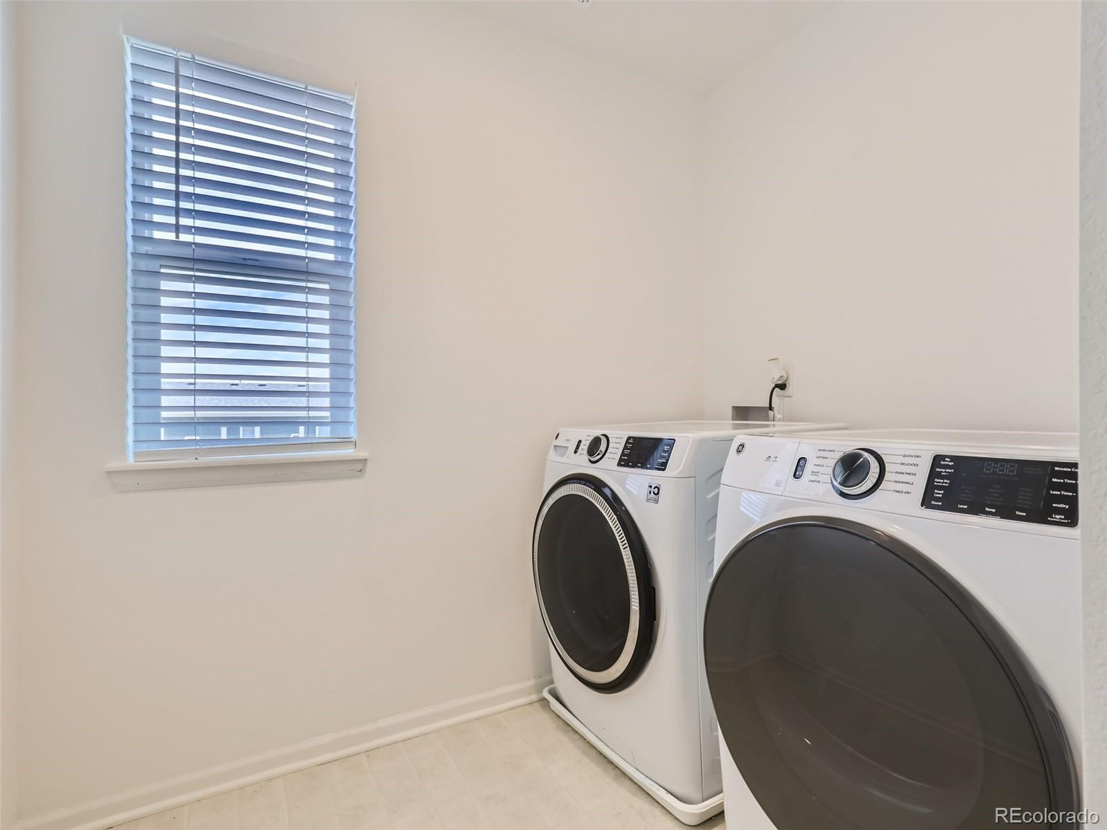 6430 Dry Fork Circle Frederick, CO 80516 - Photo 23 of 32 a utility room with dryer and washer