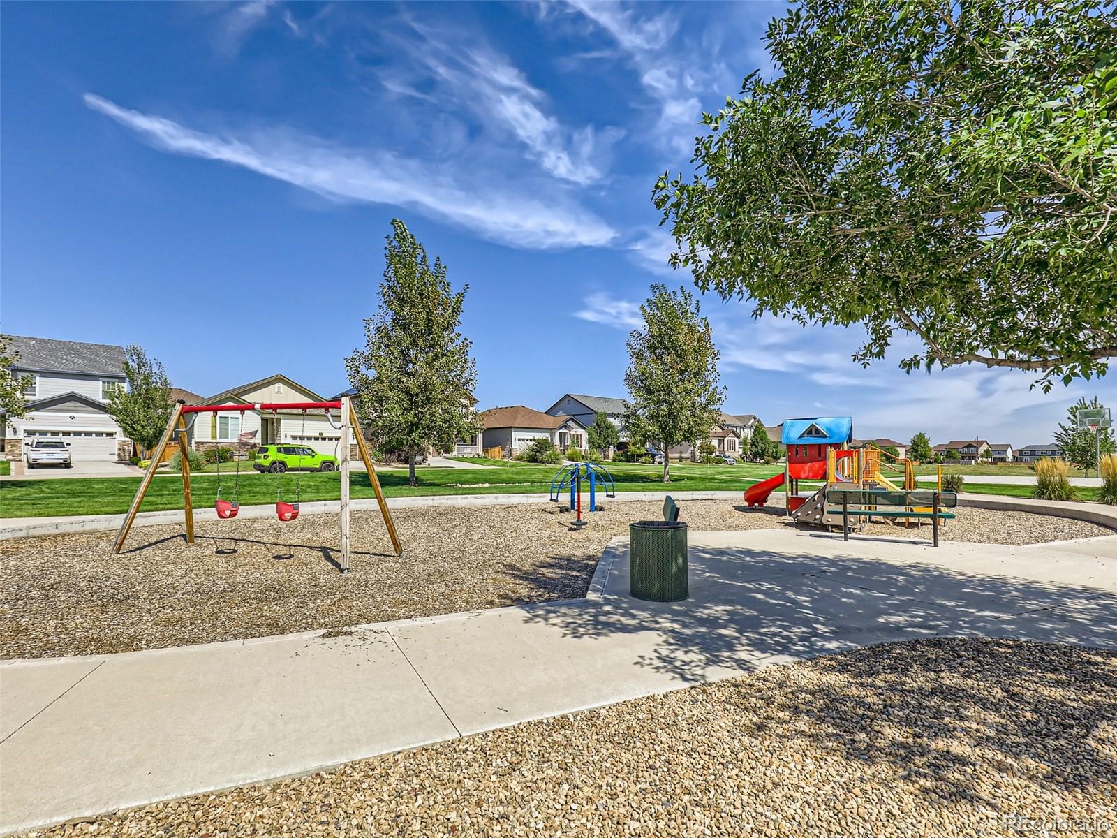6430 Dry Fork Circle Frederick, CO 80516 - Photo 31 of 32 a view of a park with swings and slides