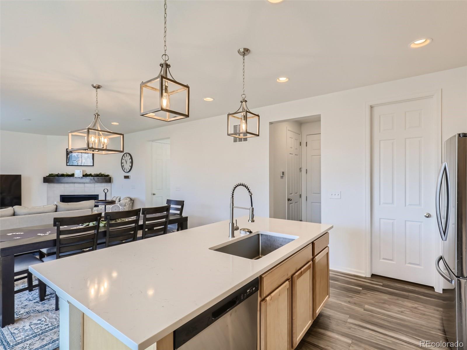 6430 Dry Fork Circle Frederick, CO 80516 - Photo 4 of 32 a kitchen with stainless steel appliances a sink and a stove