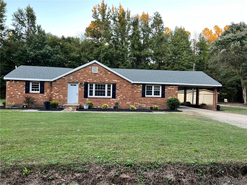 9427 Lebanon Church Road Jarratt, VA 23867 - Photo 1 of 16 Single story home with a carport and a front lawn