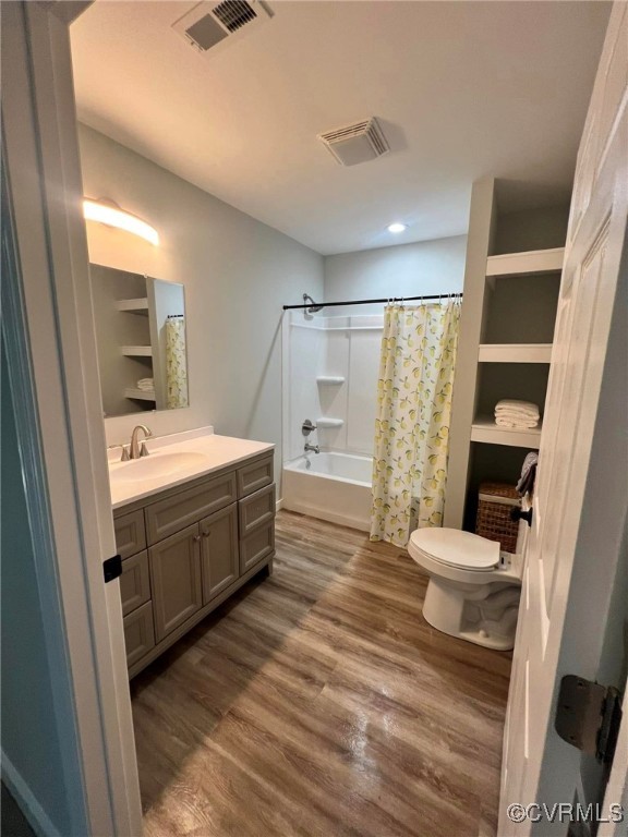 9427 Lebanon Church Road Jarratt, VA 23867 - Photo 14 of 16 Full bathroom featuring hardwood / wood-style floo