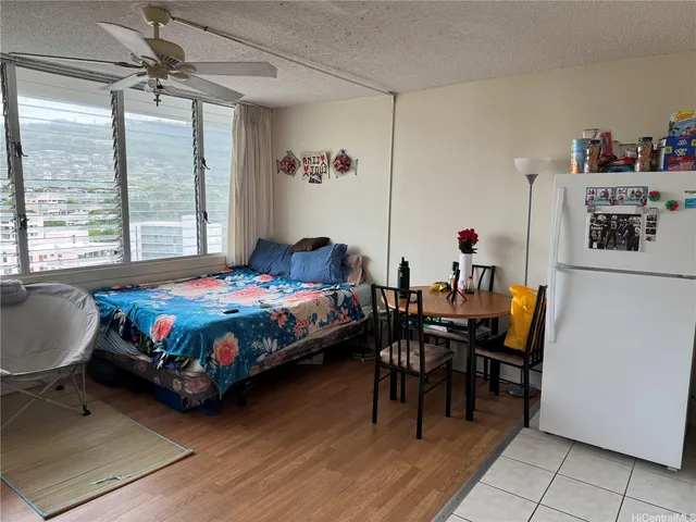 an aerial view of a residential apartment building with a yard