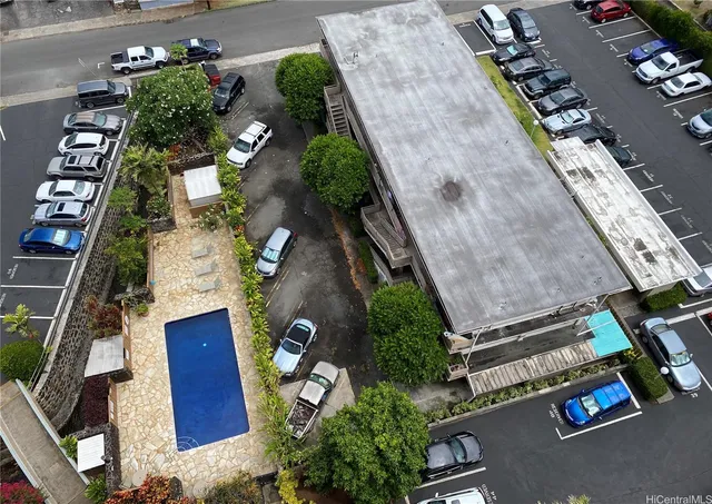 a bedroom with furniture and a flat screen tv