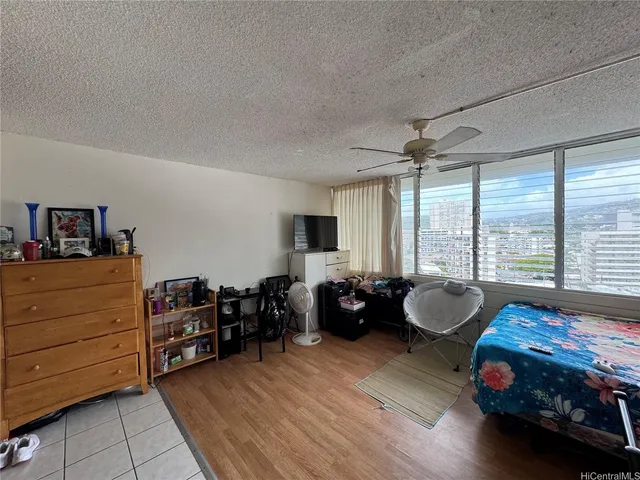 a bathroom with a glass shower door and a mirror