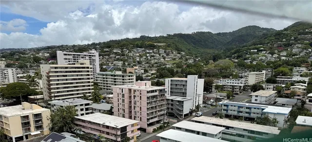 a kitchen with stainless steel appliances white cabinets and a refrigerator