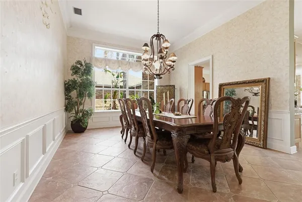 a patio with a yard table and chairs