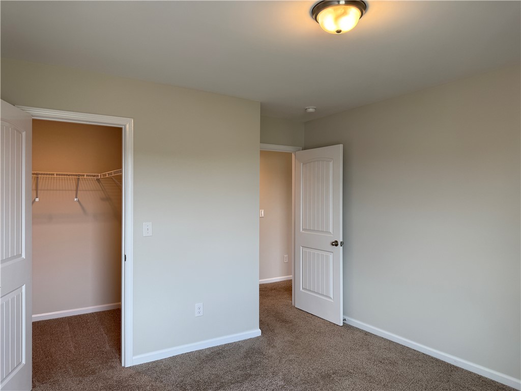 117 Weaver Way Pendleton, SC 29670 - Photo 17 of 19 A well-lit bedroom provides ample storage with an integrated closet system.