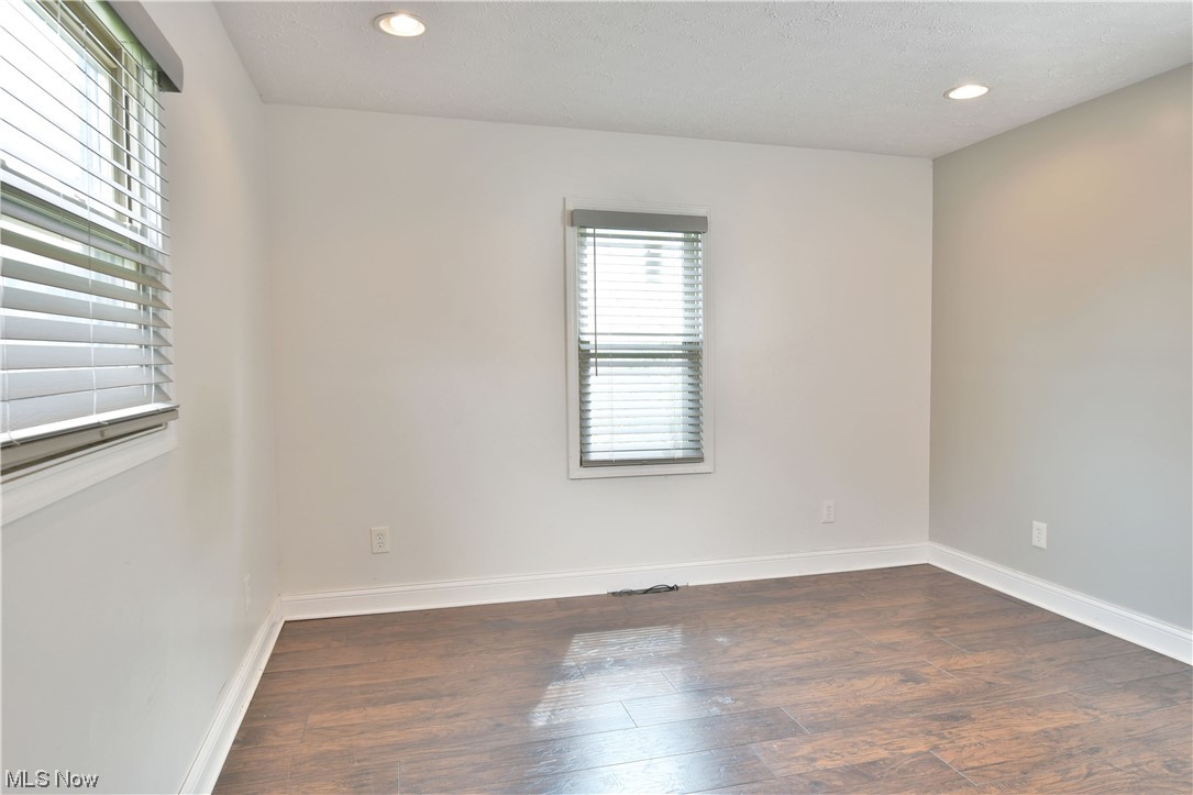 1711 Salt Springs Road Mineral Ridge, OH 44440 - Photo 25 of 35 View of wood floored spare room
