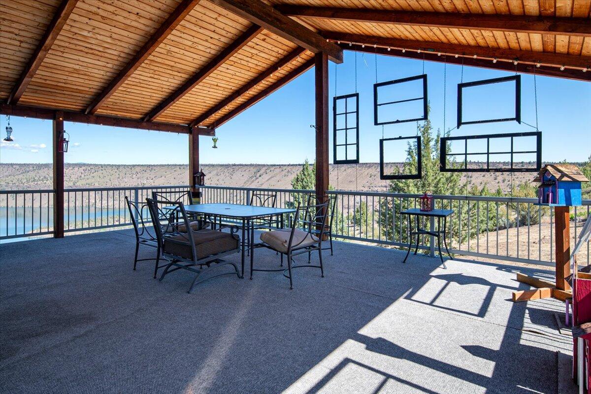 11182 Southwest Dynamite Lane Culver, OR 97734 - Photo 17 of 70 a view of a patio with a table and chairs