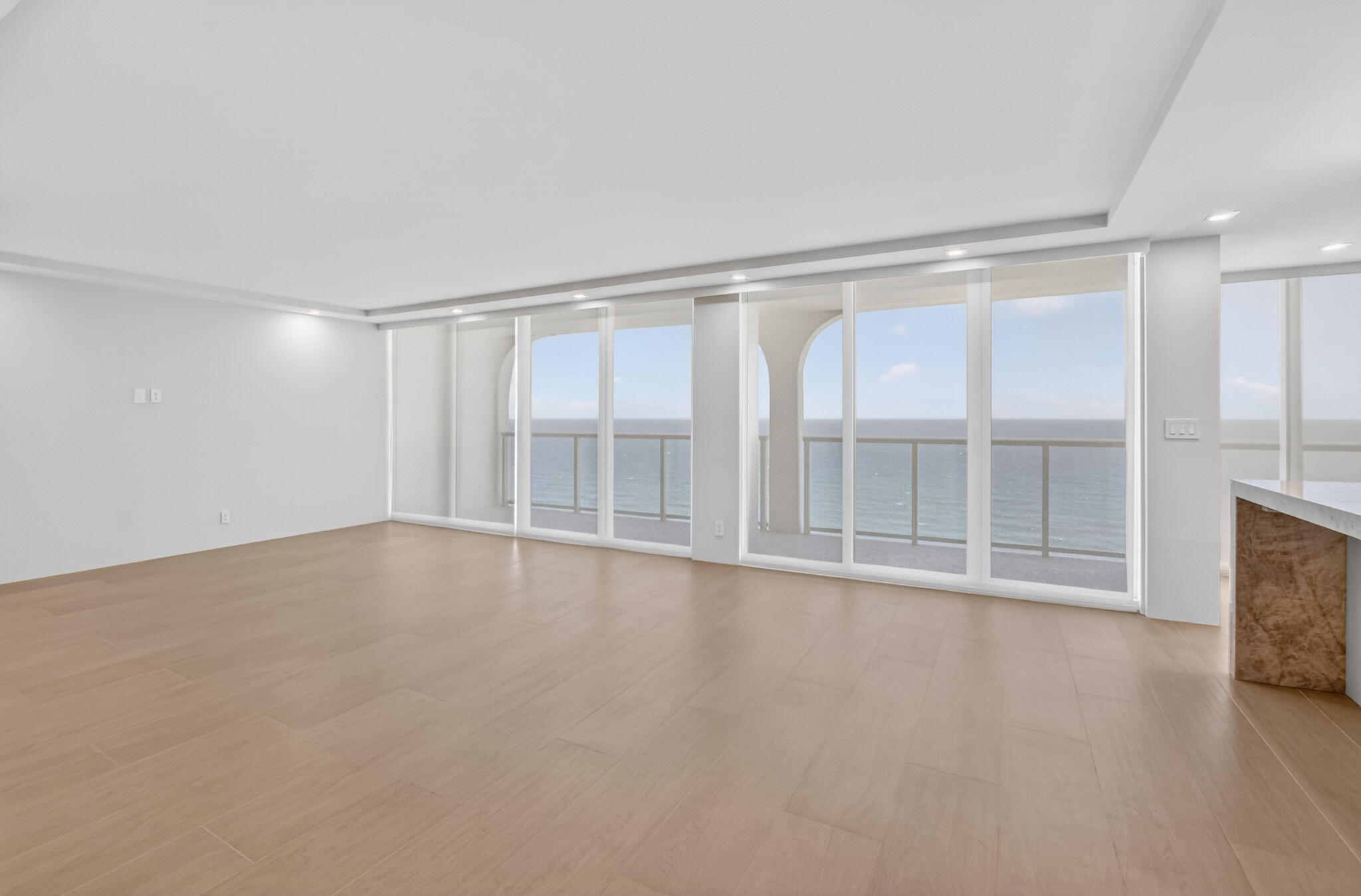 2800 South Ocean Boulevard, Unit 23C Boca Raton, FL 33432 - Photo 8 of 50 a view of an empty room with a window and wooden floor