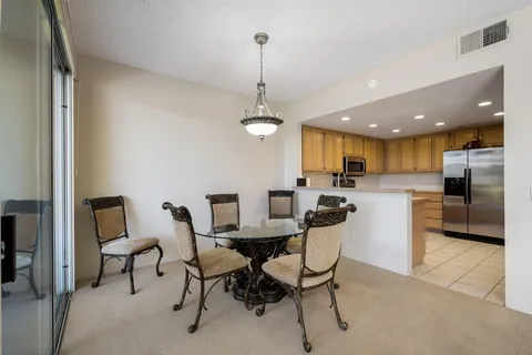 a kitchen with stainless steel appliances granite countertop a sink and a window