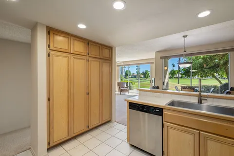 a bedroom with a bed and ceiling fan