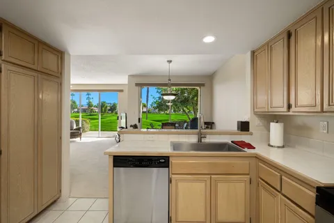 a view of walk in closet with white walls