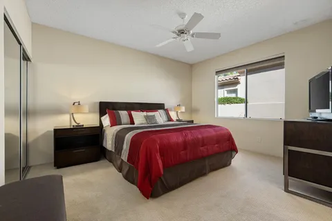 a front view of a house with a yard table and chairs