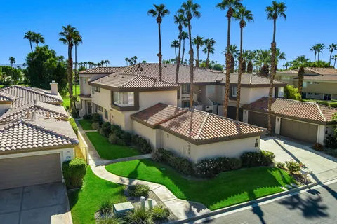 a view of a lush green hillside and a houses