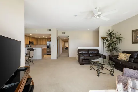 a kitchen with stainless steel appliances granite countertop a sink and a window