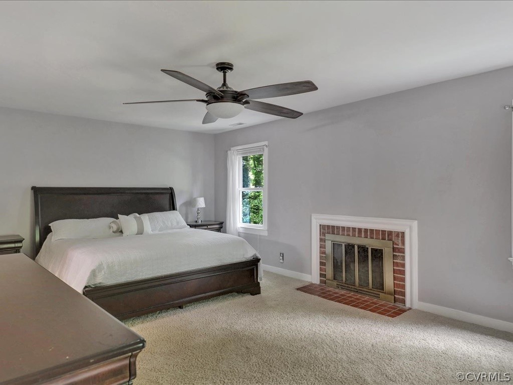 1909 Fairoaks Road Powhatan, VA 23139 - Photo 19 of 34 Master Bedroom with carpet, wood burning brick fir