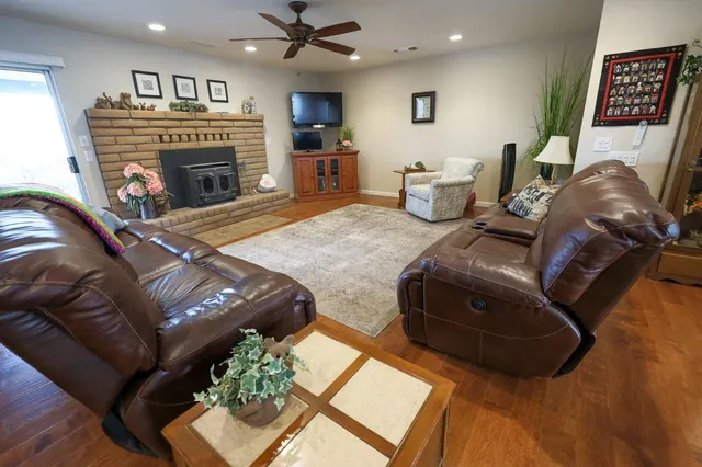 a living room with furniture and a fireplace