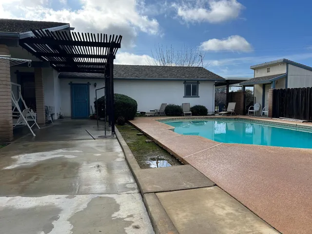 a view of a house with a swimming pool