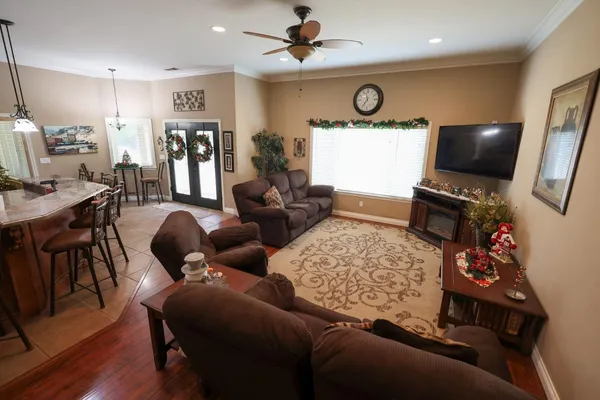 a living room with furniture and a flat screen tv