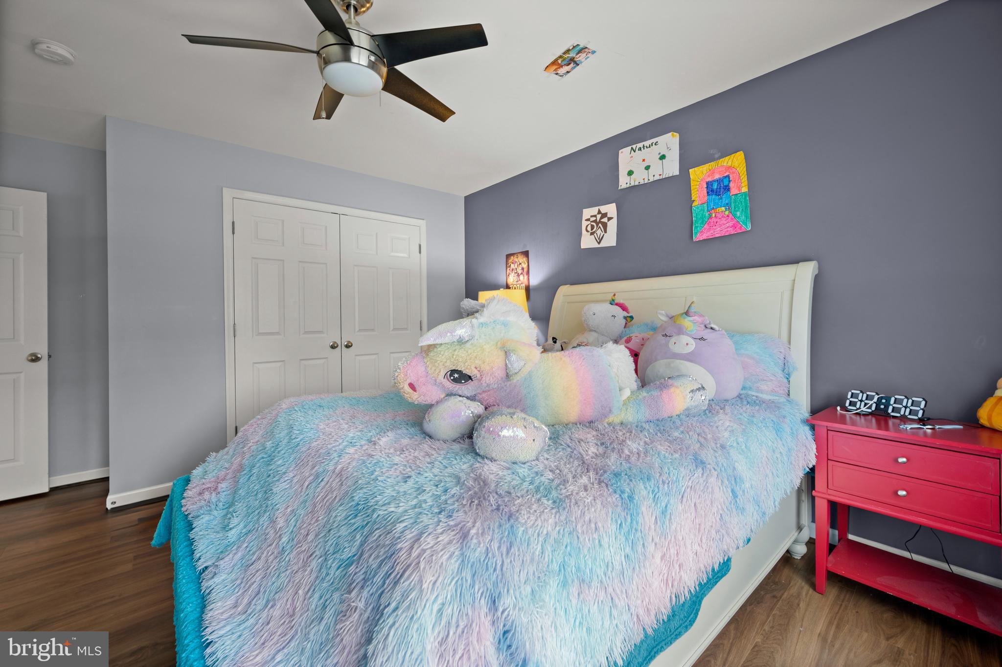734 Holden Road Frederick, MD 21701 - Photo 22 of 46 a bedroom with a bed and wooden floor