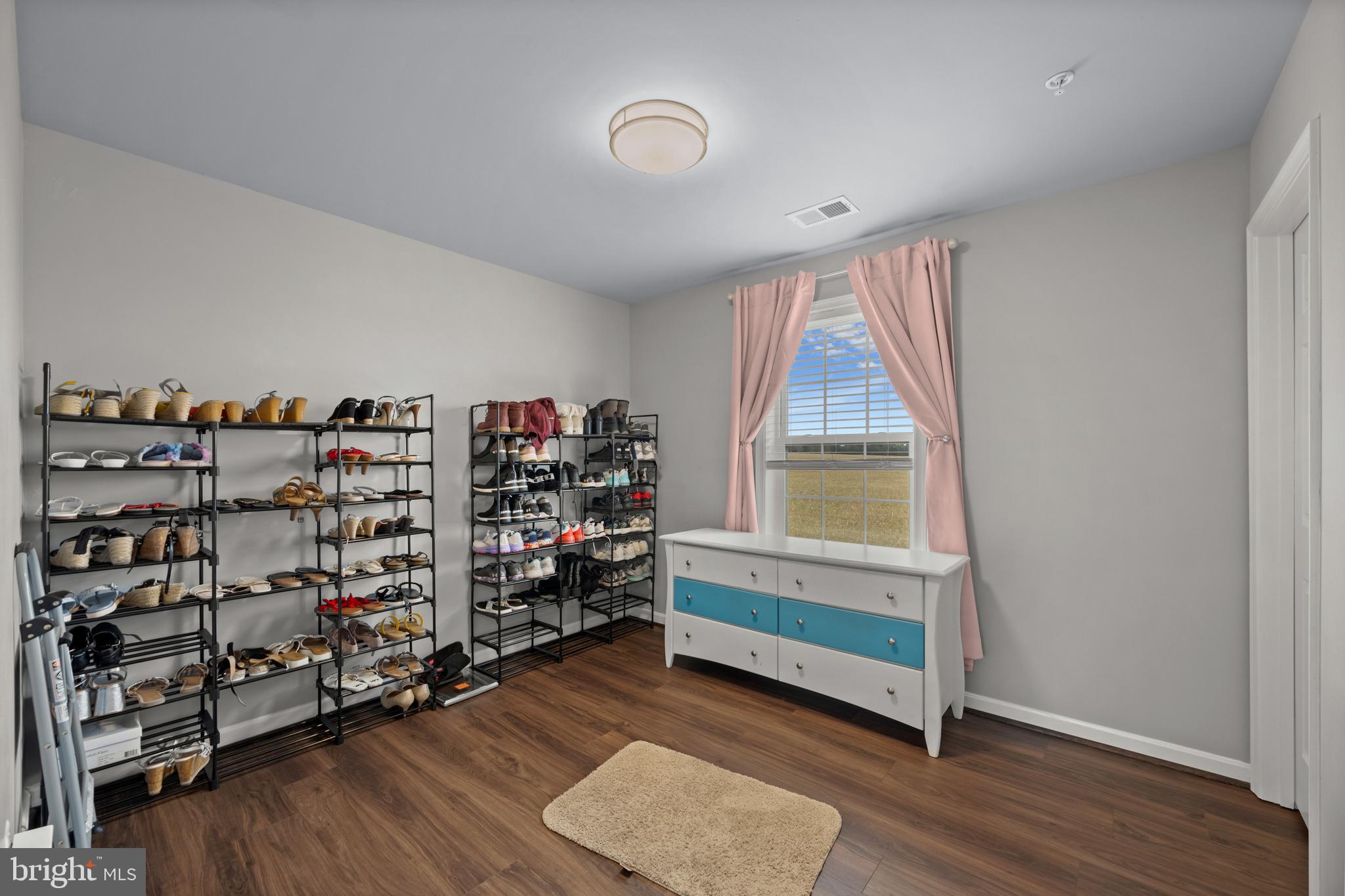 734 Holden Road Frederick, MD 21701 - Photo 27 of 46 a room with lots of wooden furniture and a window