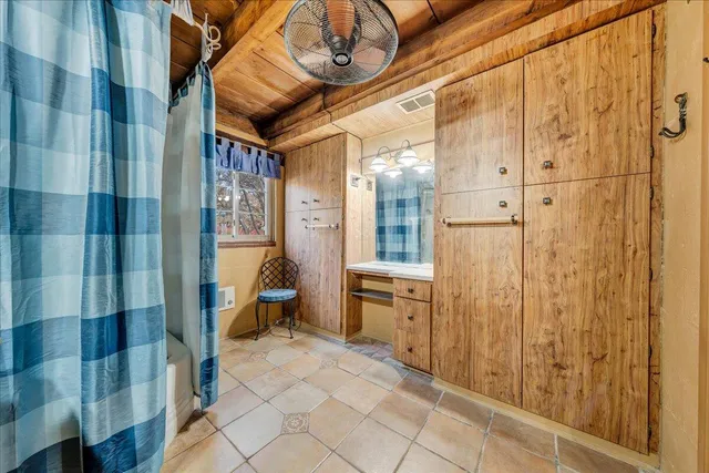 a bathroom with a sink and a shower