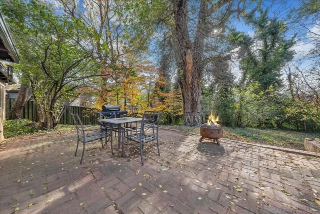 a view of a park with bench and trees