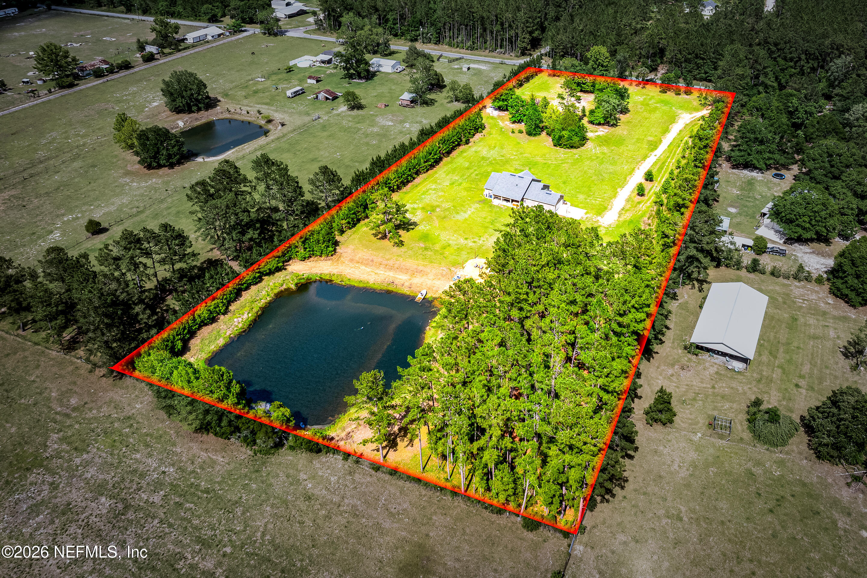 26575 Sheared Stokes Road Hilliard, FL 32046 - Photo 35 of 39 an aerial view of a house a yard and a swimming pool