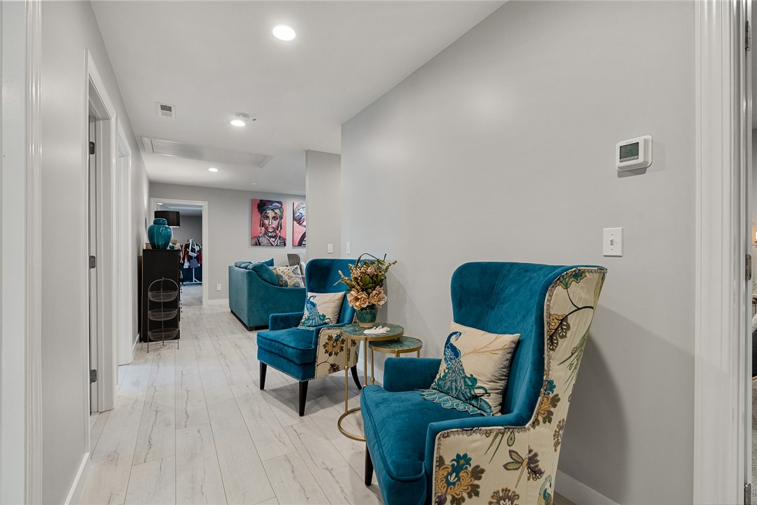 140 Turnberry Road Anderson, SC 29621 - Photo 24 of 44 This inviting hallway offers a stylish transition between living spaces, featuring elegant flooring and recessed lighting.
