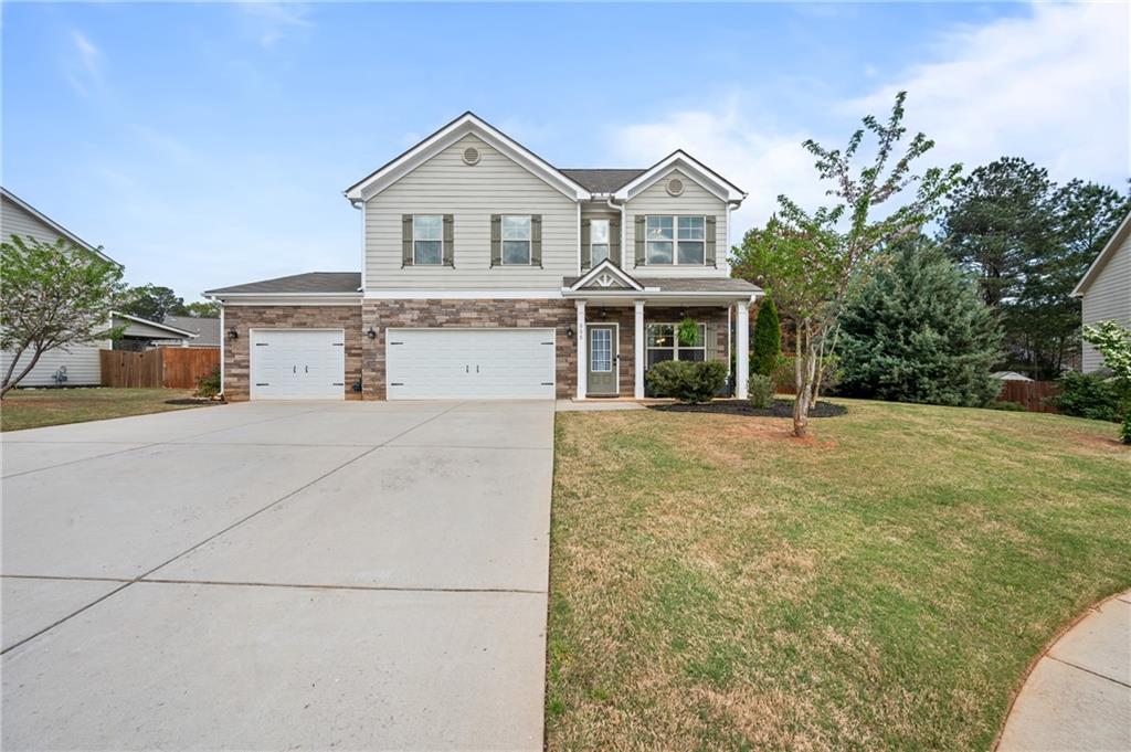 a front view of a house with a yard
