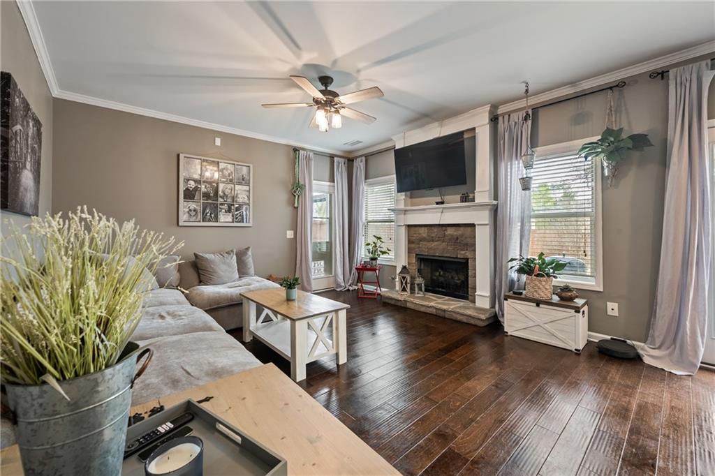 555 Evergreen Way Jefferson, GA 30549 - Photo 21 of 69 a living room with furniture fireplace and flat screen tv