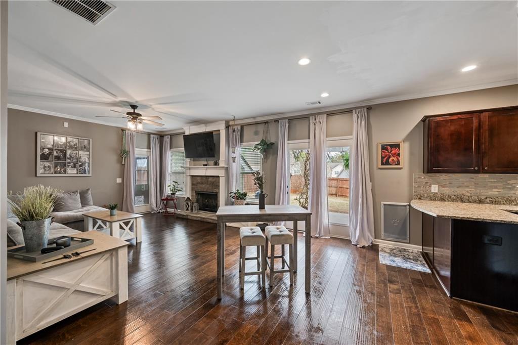 555 Evergreen Way Jefferson, GA 30549 - Photo 22 of 69 a living room with furniture flat screen tv and wooden floor