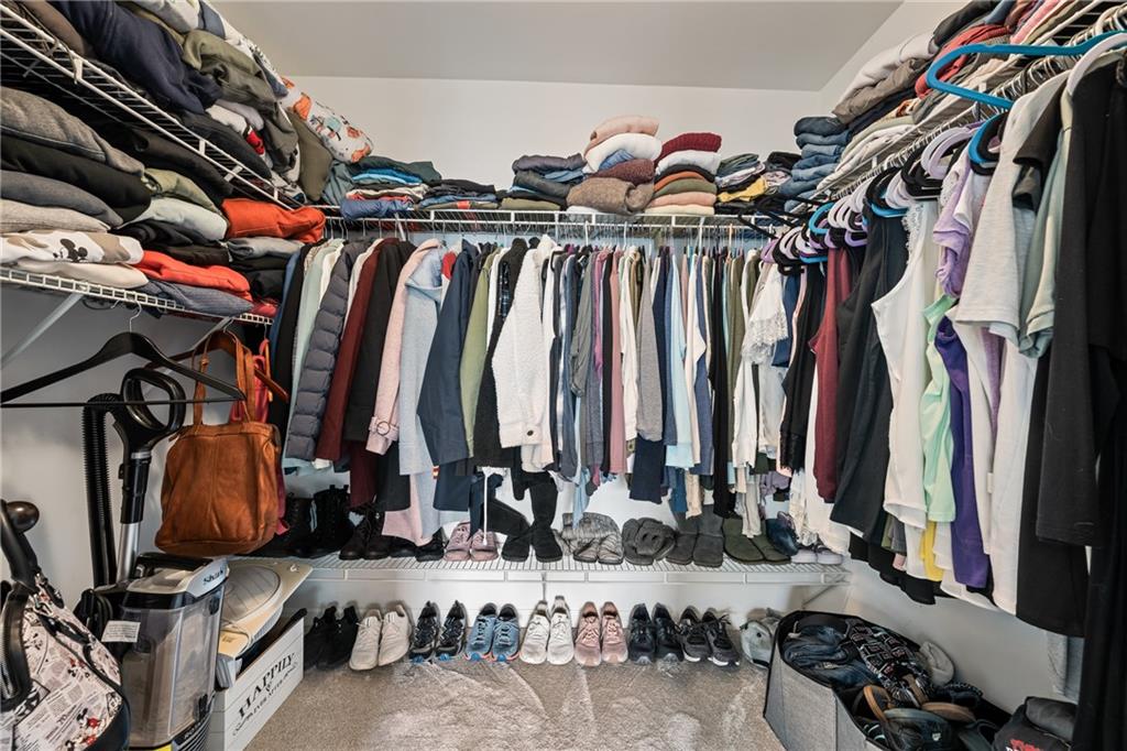 555 Evergreen Way Jefferson, GA 30549 - Photo 35 of 69 a view of walk in closet with clothes