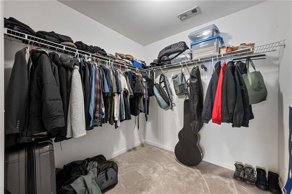 555 Evergreen Way Jefferson, GA 30549 - Photo 39 of 69 a view of walk in closet with clothes and shoes