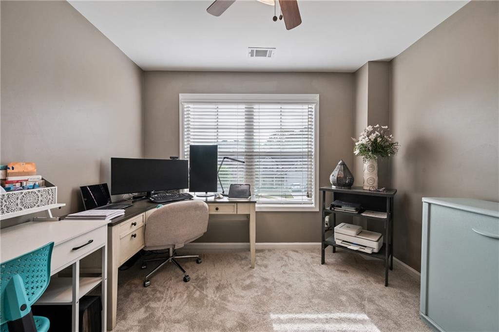 555 Evergreen Way Jefferson, GA 30549 - Photo 40 of 69 a view of a workspace with furniture and a window