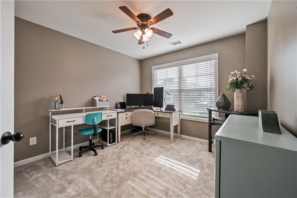 555 Evergreen Way Jefferson, GA 30549 - Photo 41 of 69 a view of a workspace with furniture and a window