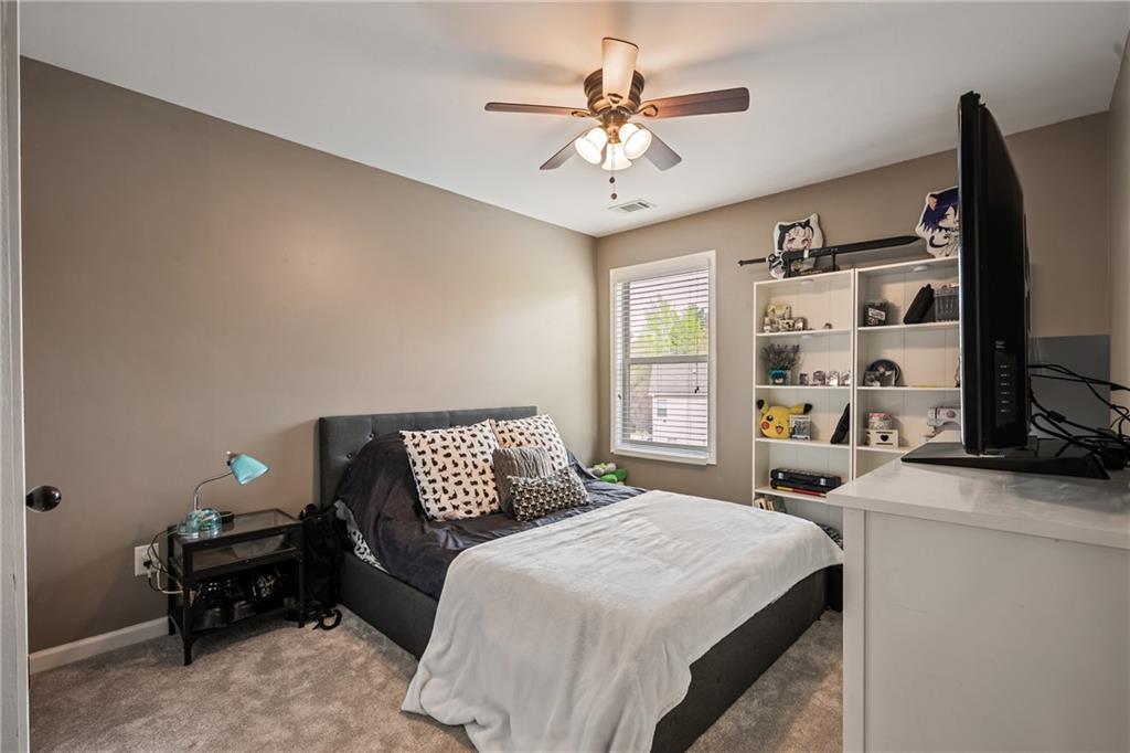 555 Evergreen Way Jefferson, GA 30549 - Photo 43 of 69 a bedroom with a bed furniture and a flat screen tv