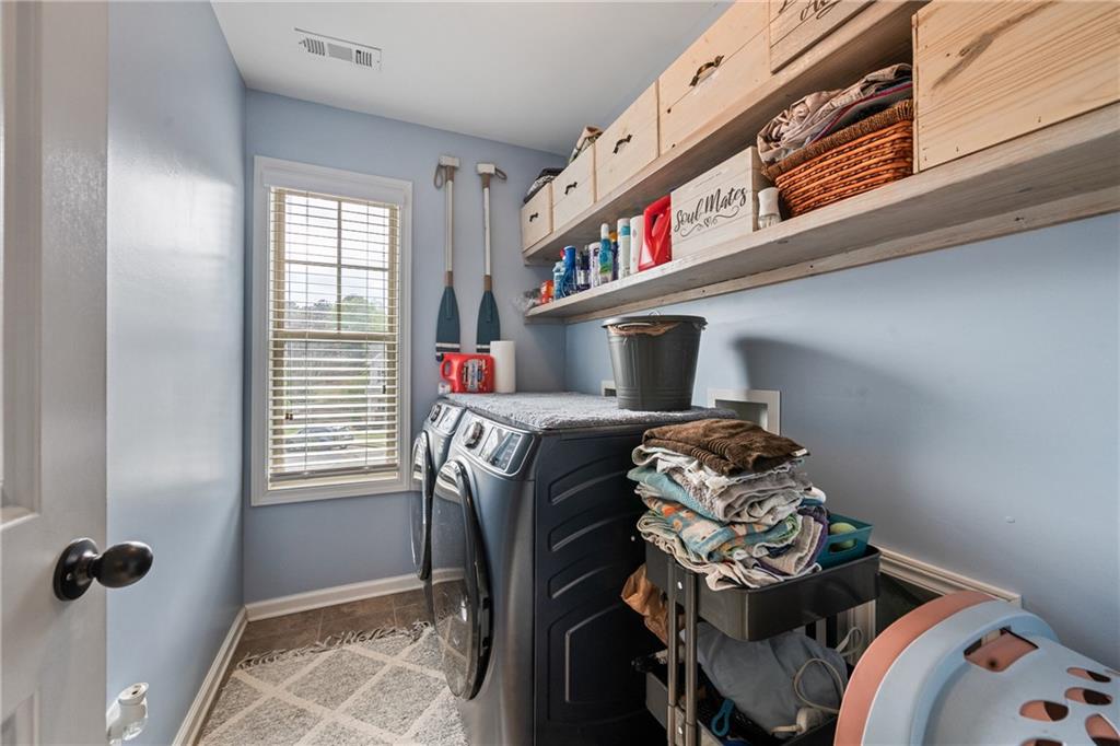 555 Evergreen Way Jefferson, GA 30549 - Photo 46 of 69 a bedroom with a bed and a window