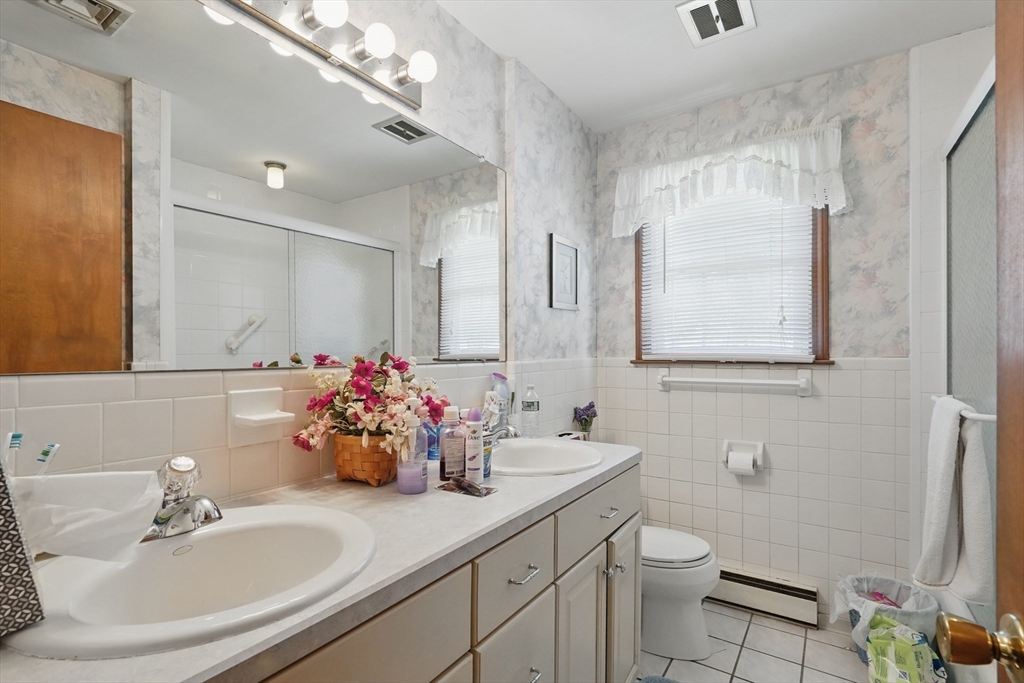 153 Maple Road Longmeadow, MA 01106 - Photo 19 of 29 a bathroom with a sink mirror and toilet