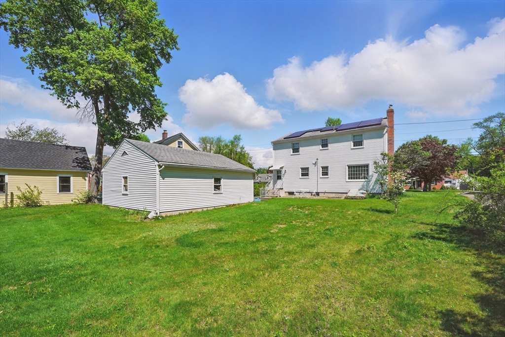 153 Maple Road Longmeadow, MA 01106 - Photo 25 of 29 a view of a house with a big yard and large trees