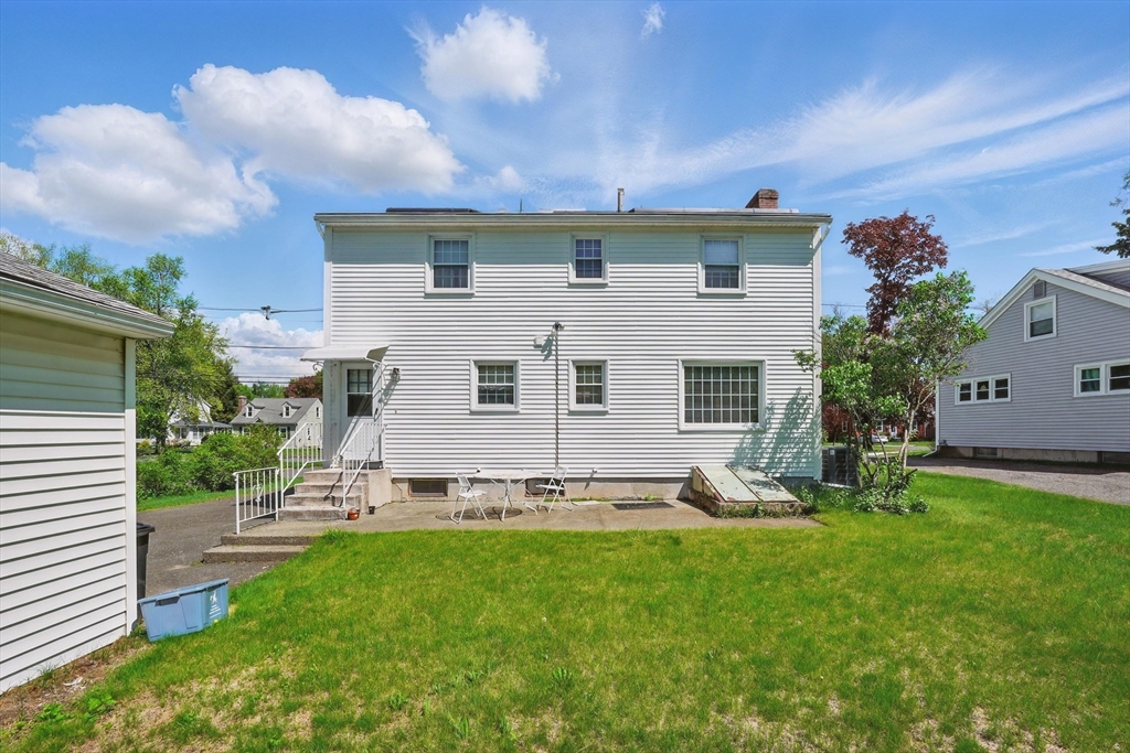 153 Maple Road Longmeadow, MA 01106 - Photo 4 of 29 a view of a house with backyard and sitting area