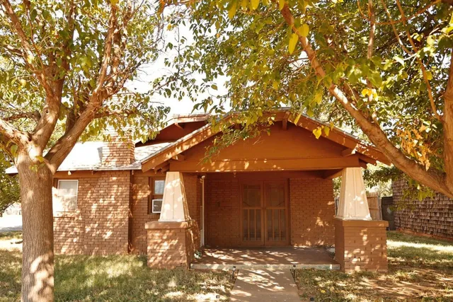 a view of a house with a tree