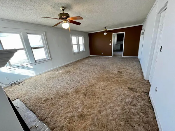 a view of an empty room and window