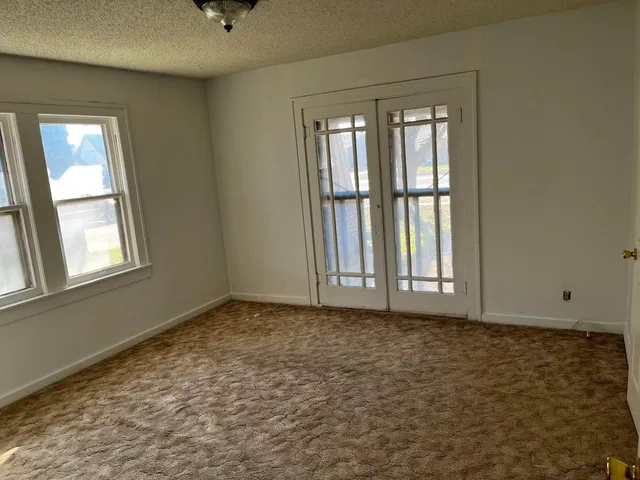 a view of an empty room with window